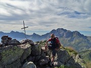 23  Alla croce della Cima delle galline (2131 m) con alle spalle il Pizzo Arera